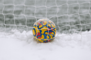 Keeping young players engaged and active through the cold, wet months can be a challenge — but it’s also an opportunity to build resilience, creativity, and team spirit. Here are 10 essential winter coaching tips to help keep winter football training sessions fun, safe, and full of energy.